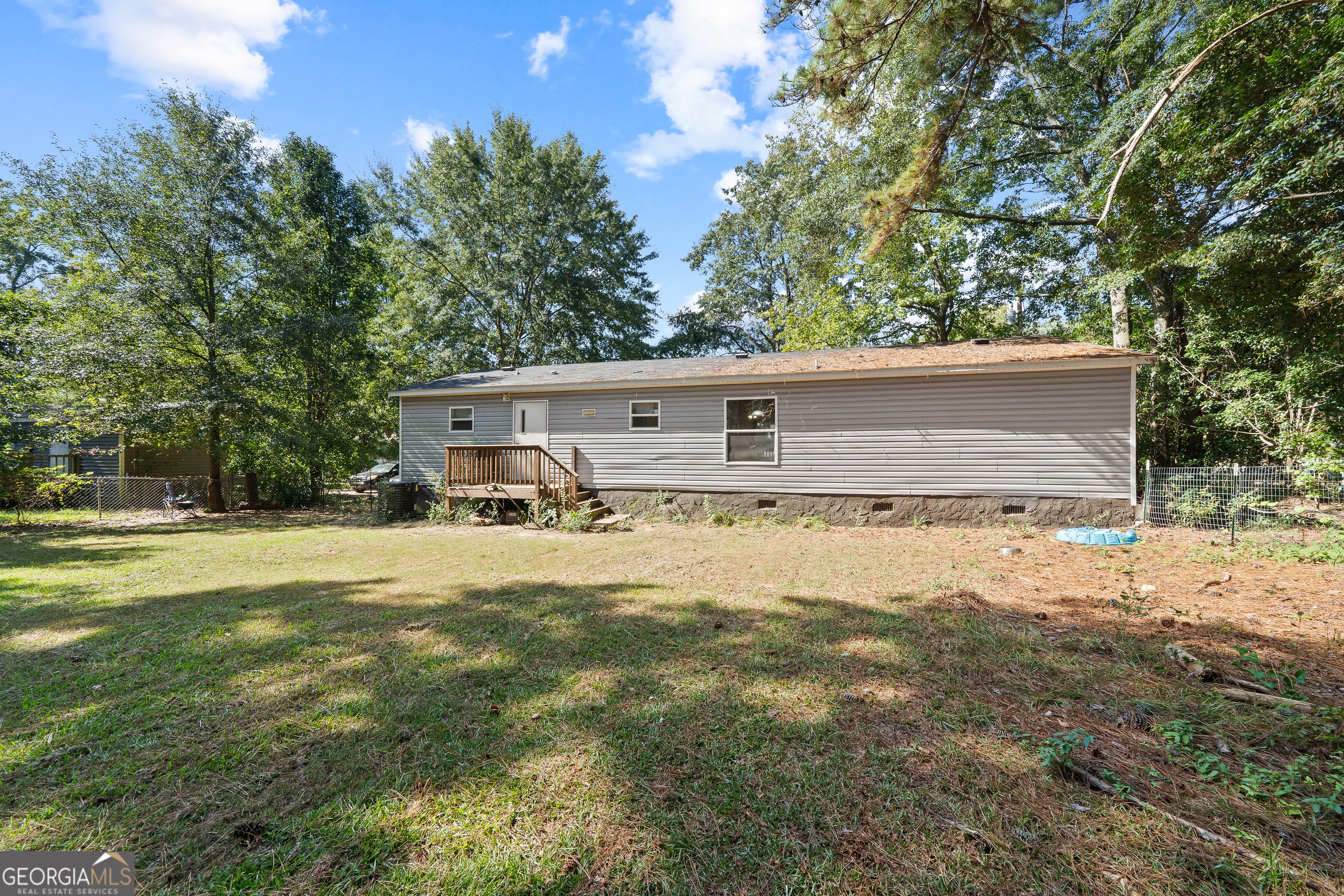 280 Lakeview Drive Locust Grove, GA 30248 - Photo 33 of 43 a view of a house with pool and a yard