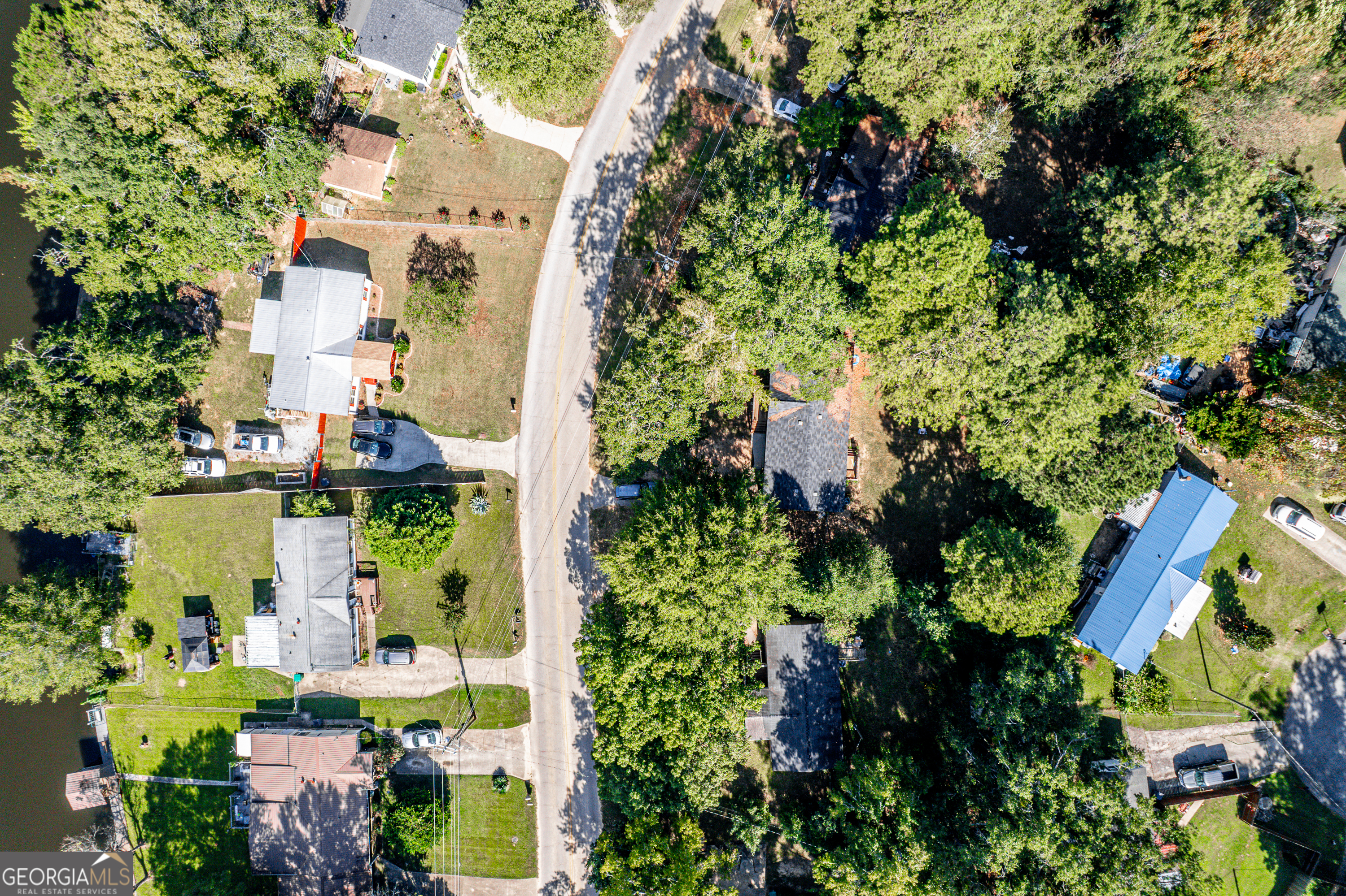280 Lakeview Drive Locust Grove, GA 30248 - Photo 35 of 43 an aerial view of residential houses with outdoor space and trees all around
