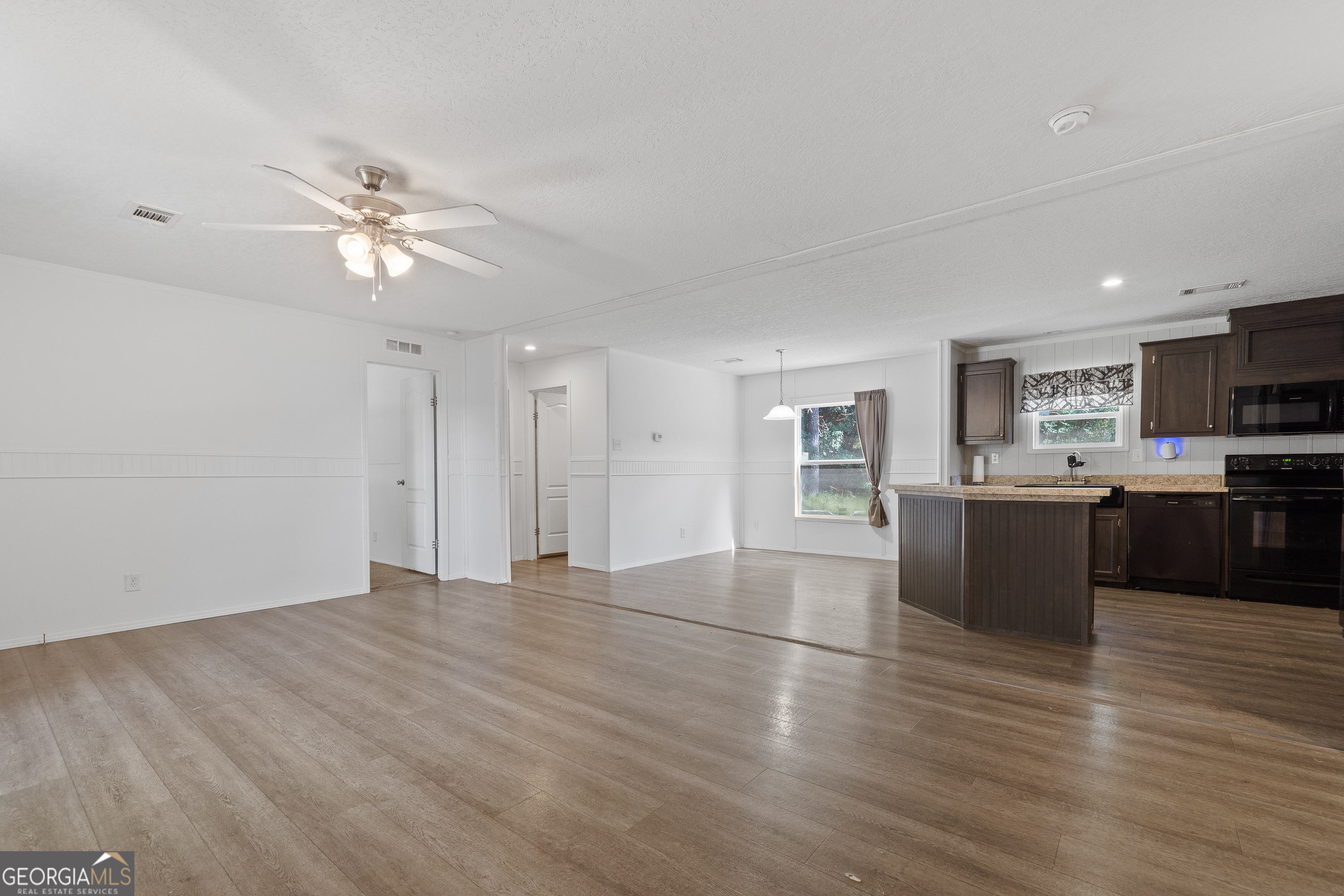 280 Lakeview Drive Locust Grove, GA 30248 - Photo 8 of 43 a view of kitchen with refrigerator and window