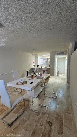 a view of balcony with furniture