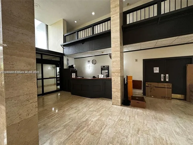 a view of gallery with wooden floor