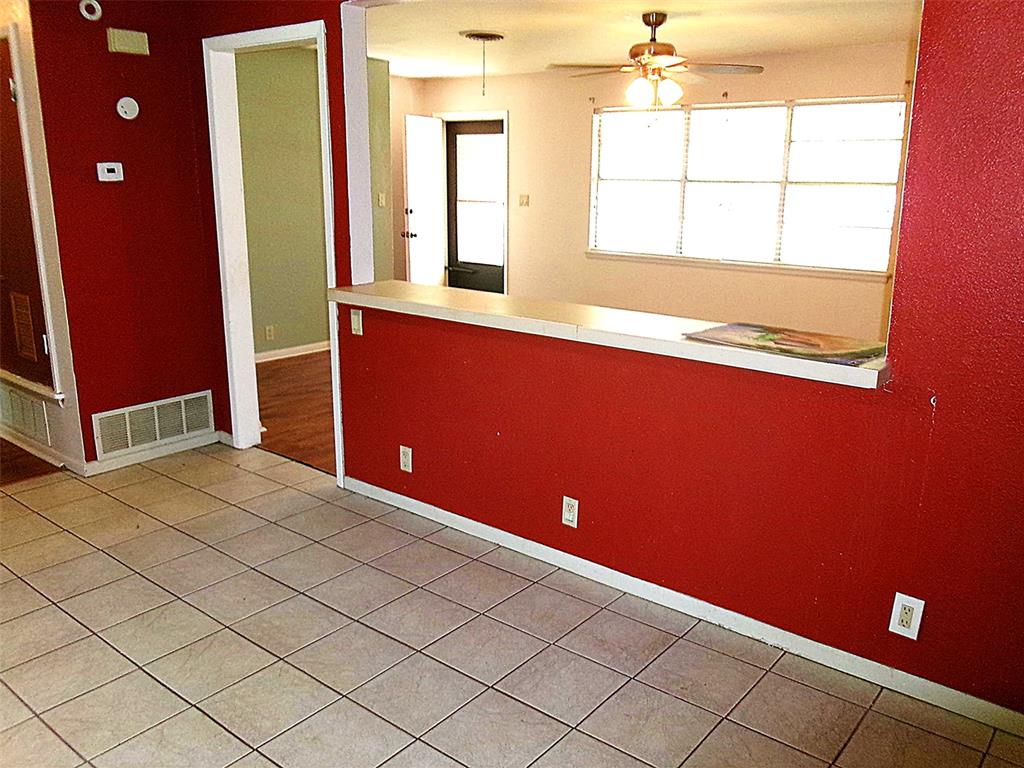 200 West Spencer Street Bangs, TX 76823 - Photo 7 of 19 Dining area with pass-through into living room