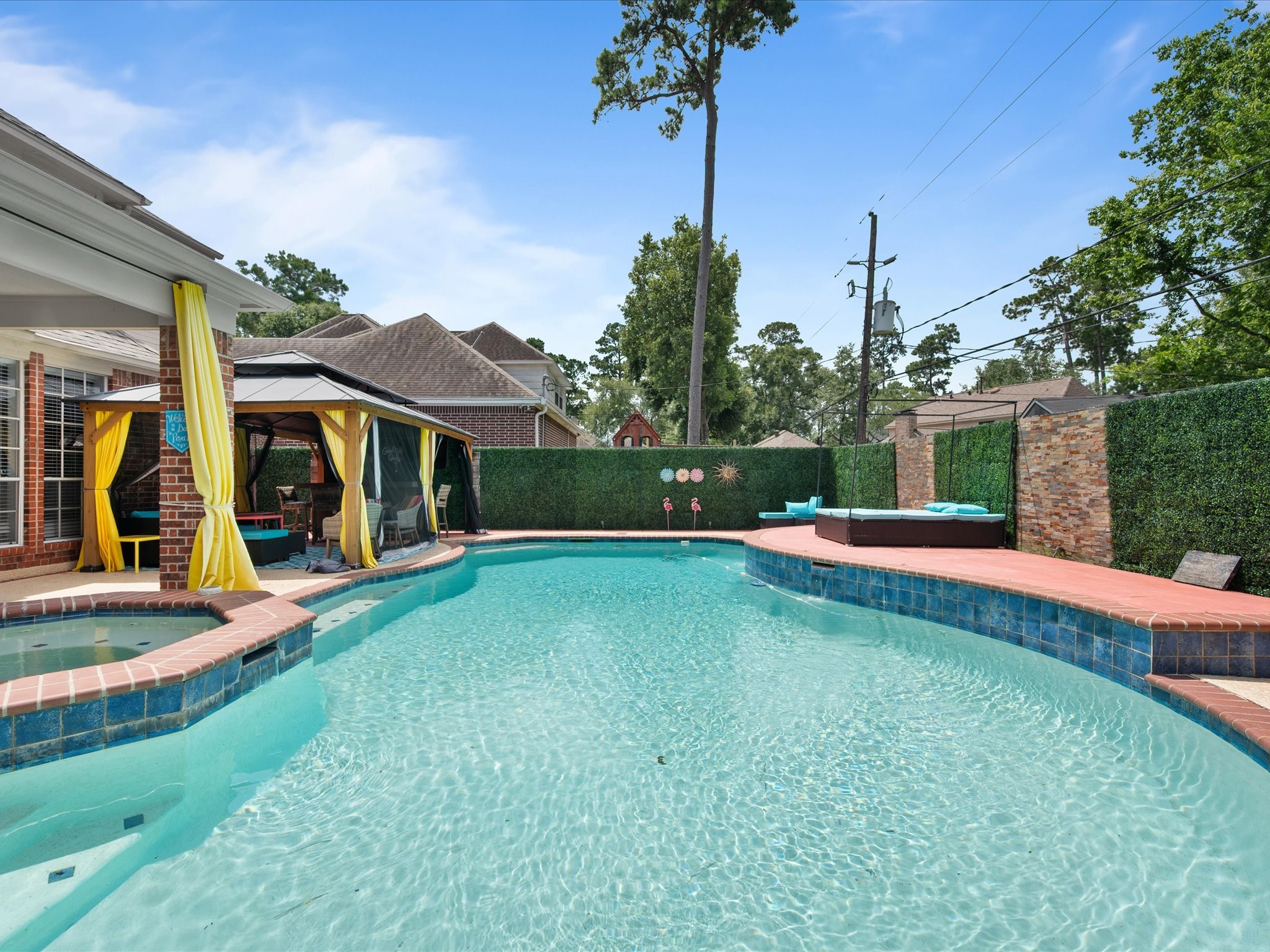16123 Lafone Drive Spring, TX 77379 - Photo 33 of 47 Designed for relaxation and entertaining alike, the backyard retreat features a sparkling pool, relaxing spa, and impressive pavilion—creating an outdoor oasis you'll never want to leave.