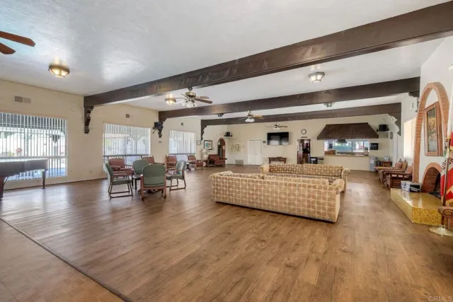 a view of a house with a swimming pool and a yard