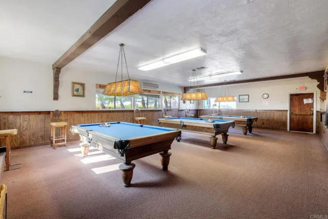 a view of a kitchen with furniture and wooden floor