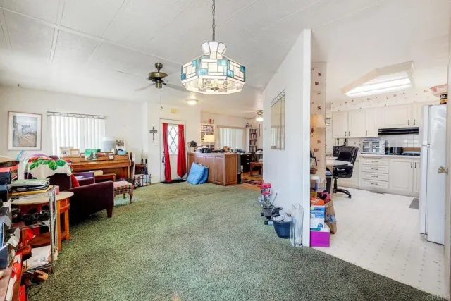 a view of a kitchen and microwave