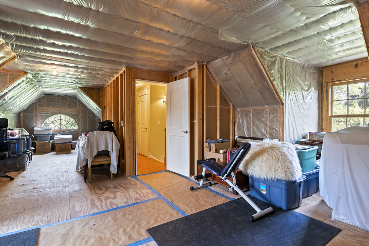 411 Selborne Road Riverside, IL 60546 - Photo 54 of 84 a living room with furniture gym equipment and a large window