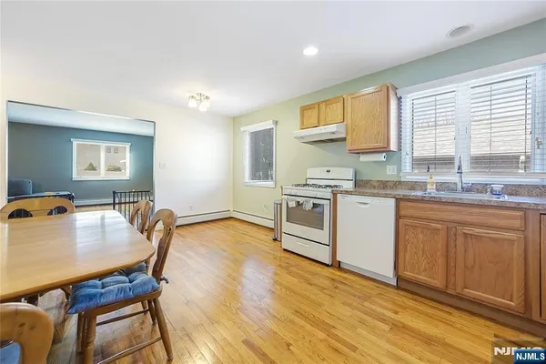 a kitchen with a sink appliances and cabinets