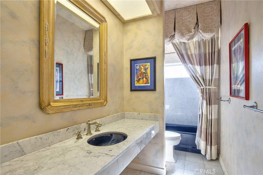46856 El Prado Road Temecula, CA 92590 - Photo 37 of 75 a bathroom with a sink and a bathtub