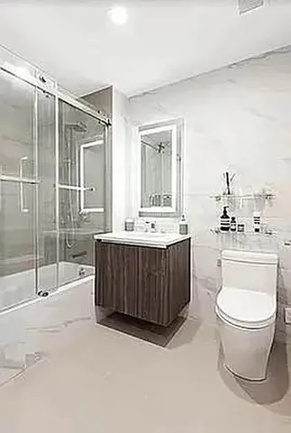 a large kitchen with a large counter top appliances and cabinets