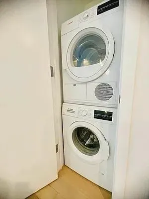 a kitchen with kitchen island a counter top a sink a stove and refrigerator