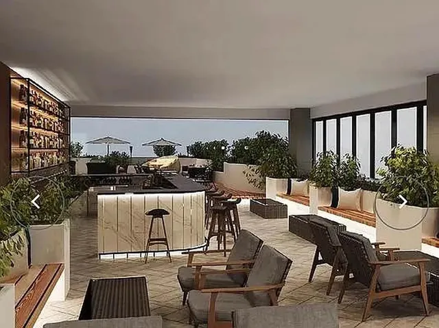 a living room with a couch and a chandelier