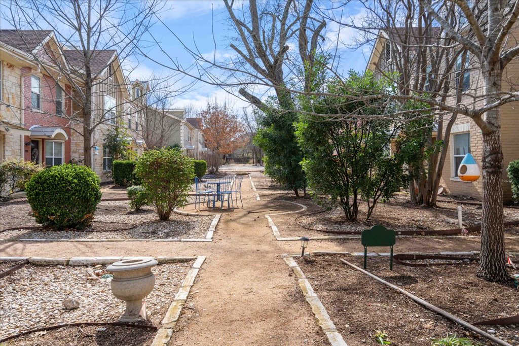1101 Grove Boulevard, Unit 203 Austin, TX 78741 - Photo 2 of 27 a view of a pathway with a yard