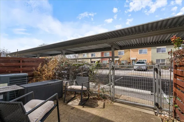 a view of a patio with table and chairs and wooden floor
