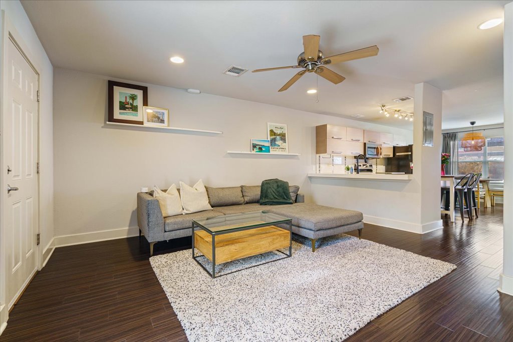 1101 Grove Boulevard, Unit 203 Austin, TX 78741 - Photo 5 of 27 a living room with furniture and wooden floor
