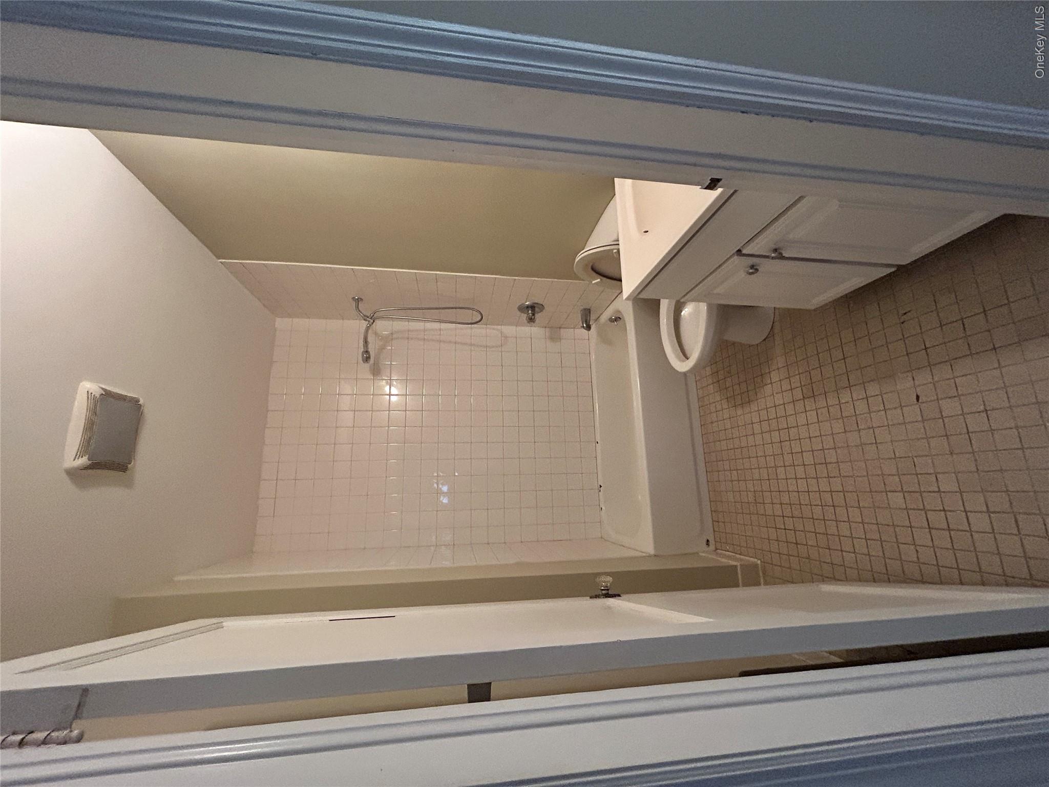853 Little Britain Road New Windsor, NY 12553 - Photo 11 of 22 a bathroom with a granite countertop sink a toilet a mirror and shower