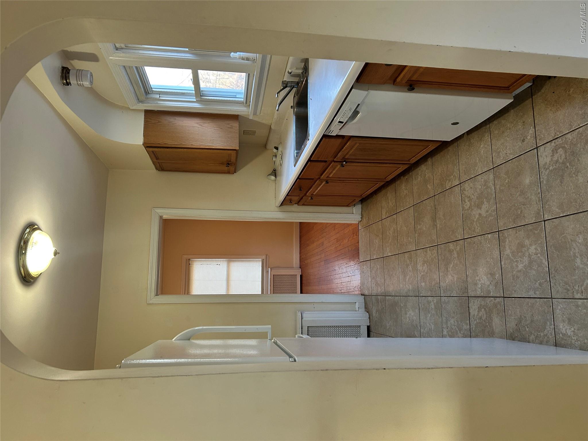 853 Little Britain Road New Windsor, NY 12553 - Photo 15 of 22 a view of a kitchen with a sink and a dishwasher