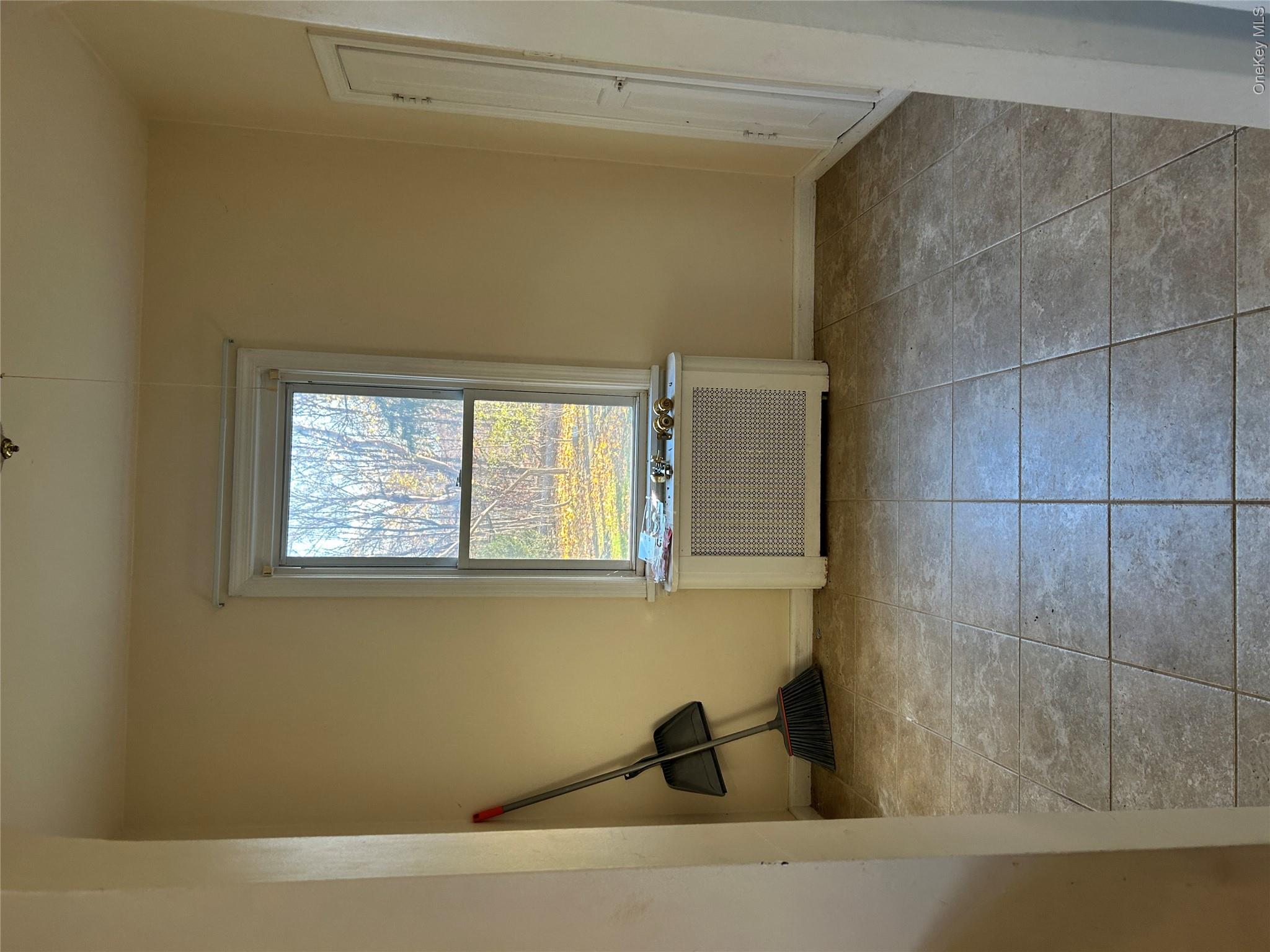 853 Little Britain Road New Windsor, NY 12553 - Photo 18 of 22 a view of an empty room with a window