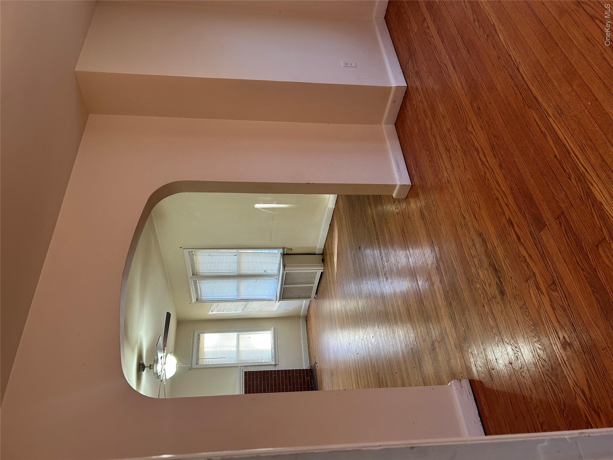 853 Little Britain Road New Windsor, NY 12553 - Photo 21 of 22 a view of an empty room with glass door and wooden floor