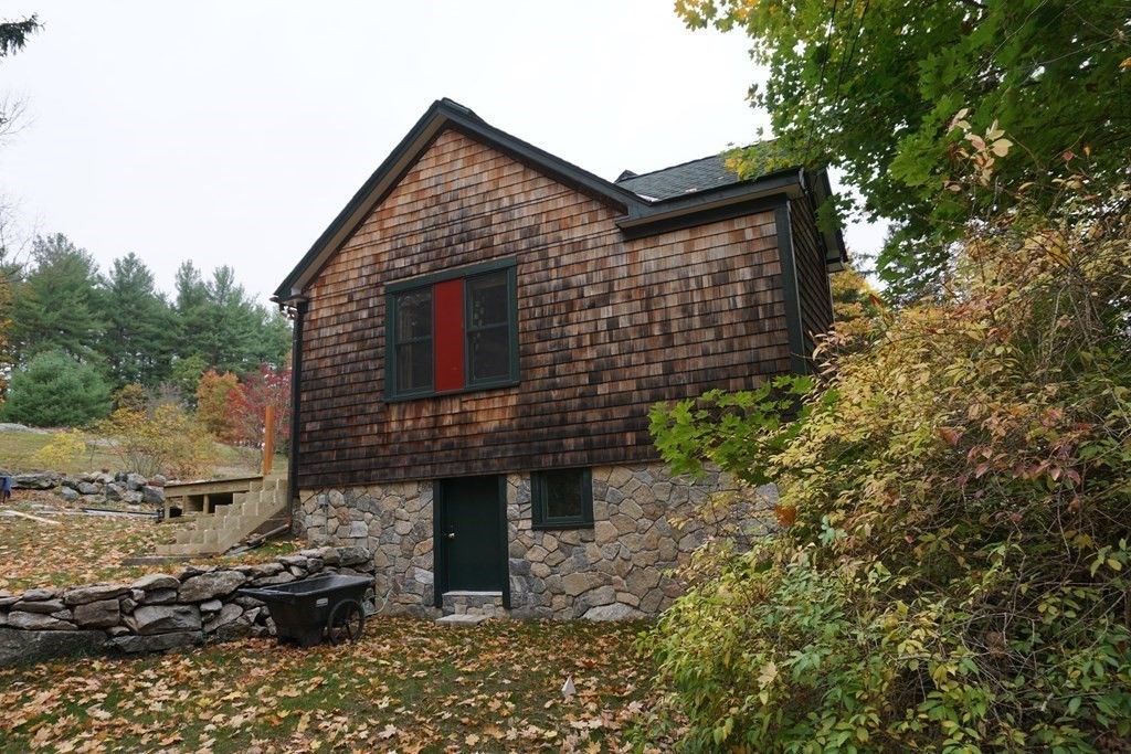 104 Still River Road Harvard, MA 01451 - Photo 3 of 42 a front view of a house with a yard