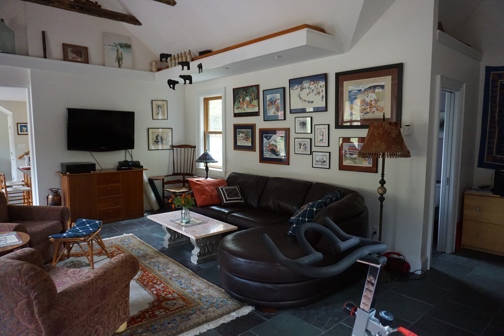 104 Still River Road Harvard, MA 01451 - Photo 8 of 42 a living room with furniture and a flat screen tv