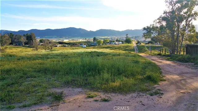 a view of a town with mountains in the background