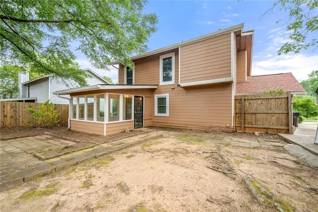 a swimming pool with outdoor seating and yard