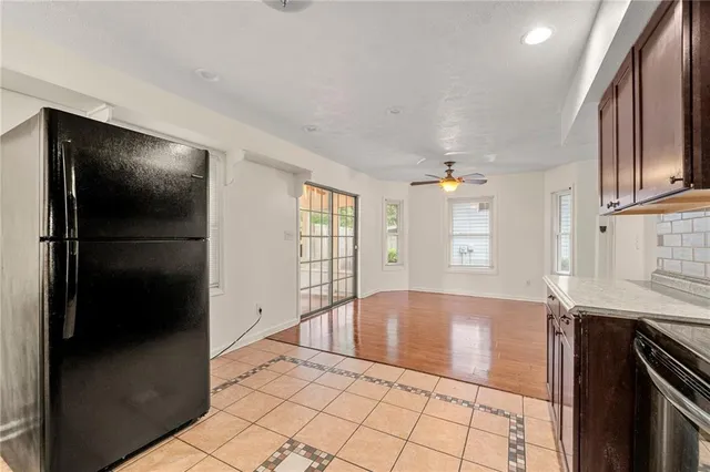 a view of a kitchen with a sink and dishwasher cabinets
