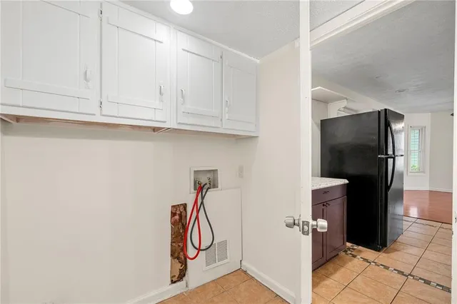 a utility room with cabinets