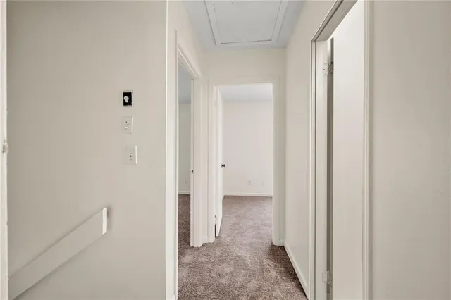 a view of a bathroom from a hallway