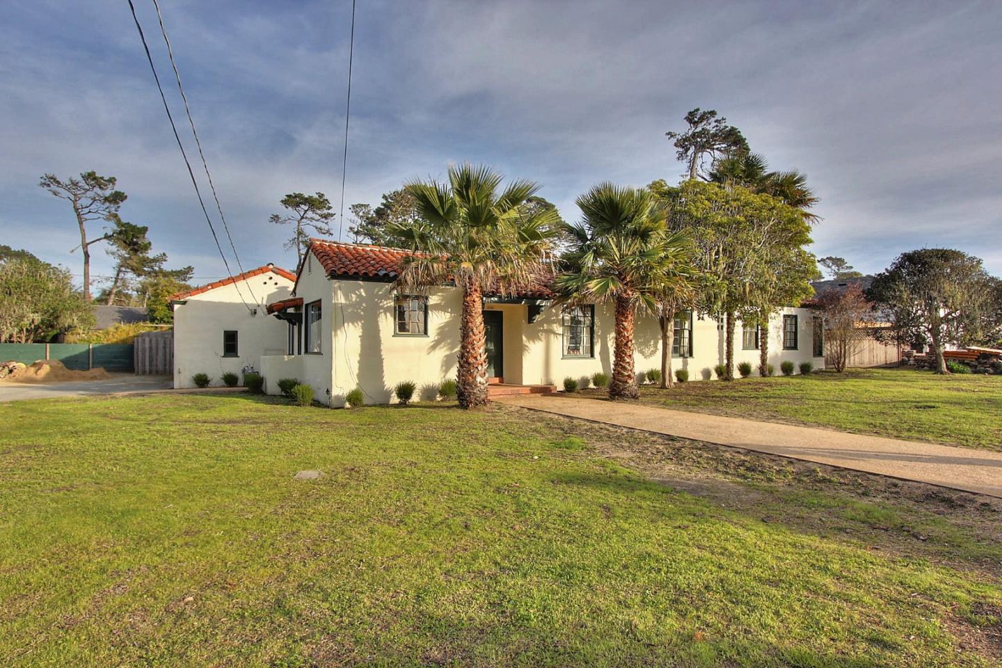3035 Valdez Road Pebble Beach, CA 93953 - Photo 1 of 60 a front view of a house with a yard and garage