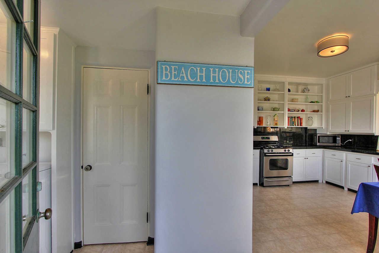 3035 Valdez Road Pebble Beach, CA 93953 - Photo 11 of 60 a kitchen with a refrigerator and a sink