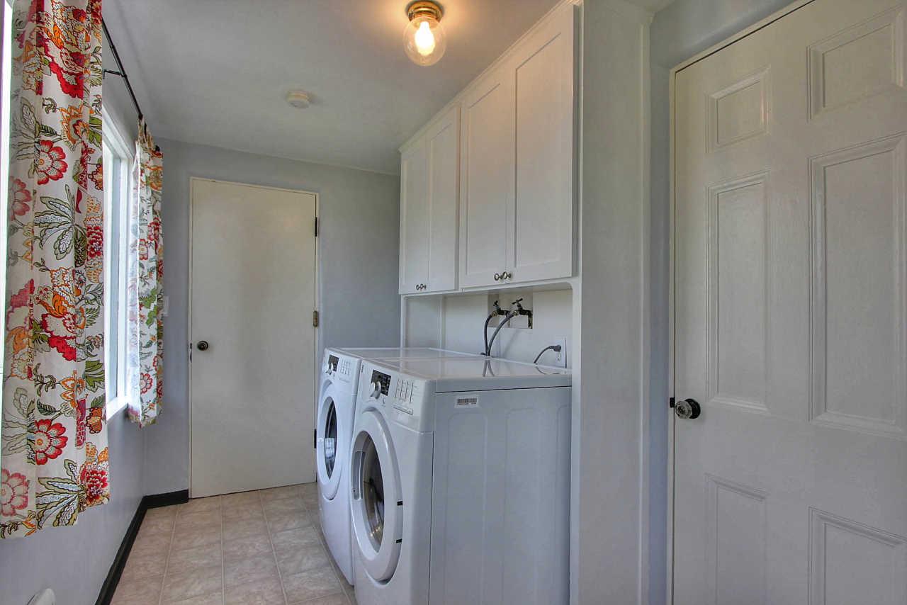 3035 Valdez Road Pebble Beach, CA 93953 - Photo 13 of 60 a view of storage and utility room with washer and dryer