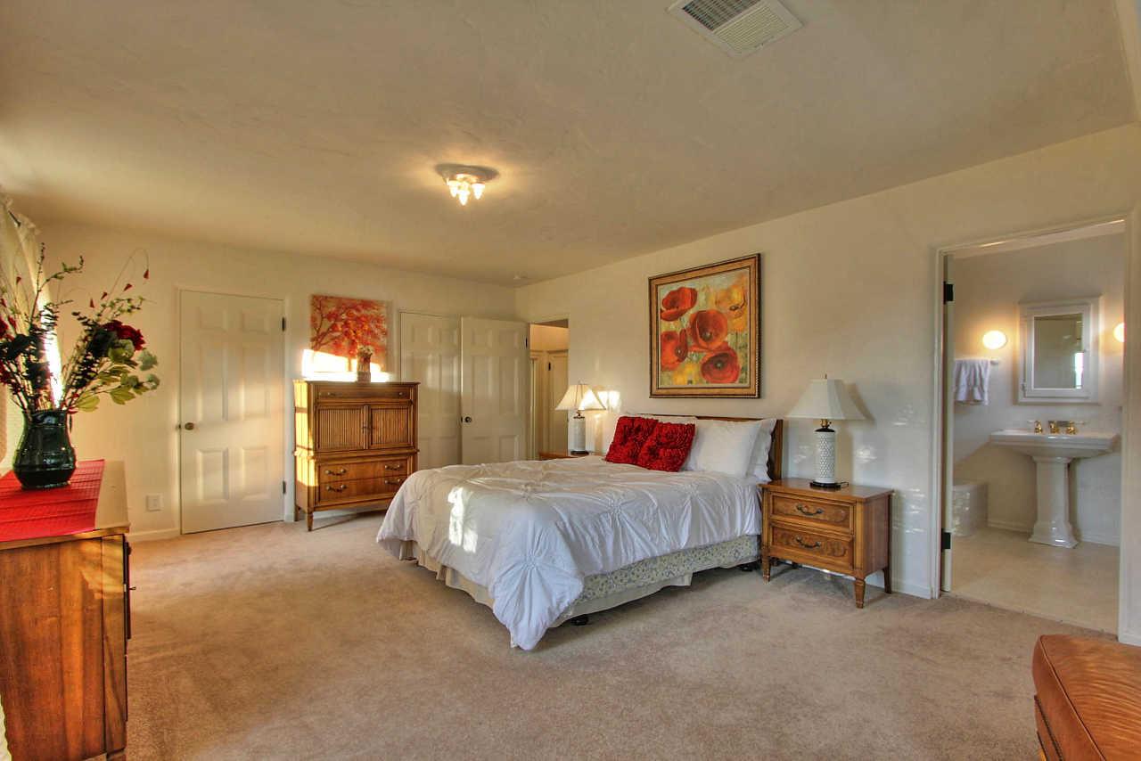 3035 Valdez Road Pebble Beach, CA 93953 - Photo 19 of 60 a bedroom with a bed and a view of walk in closet