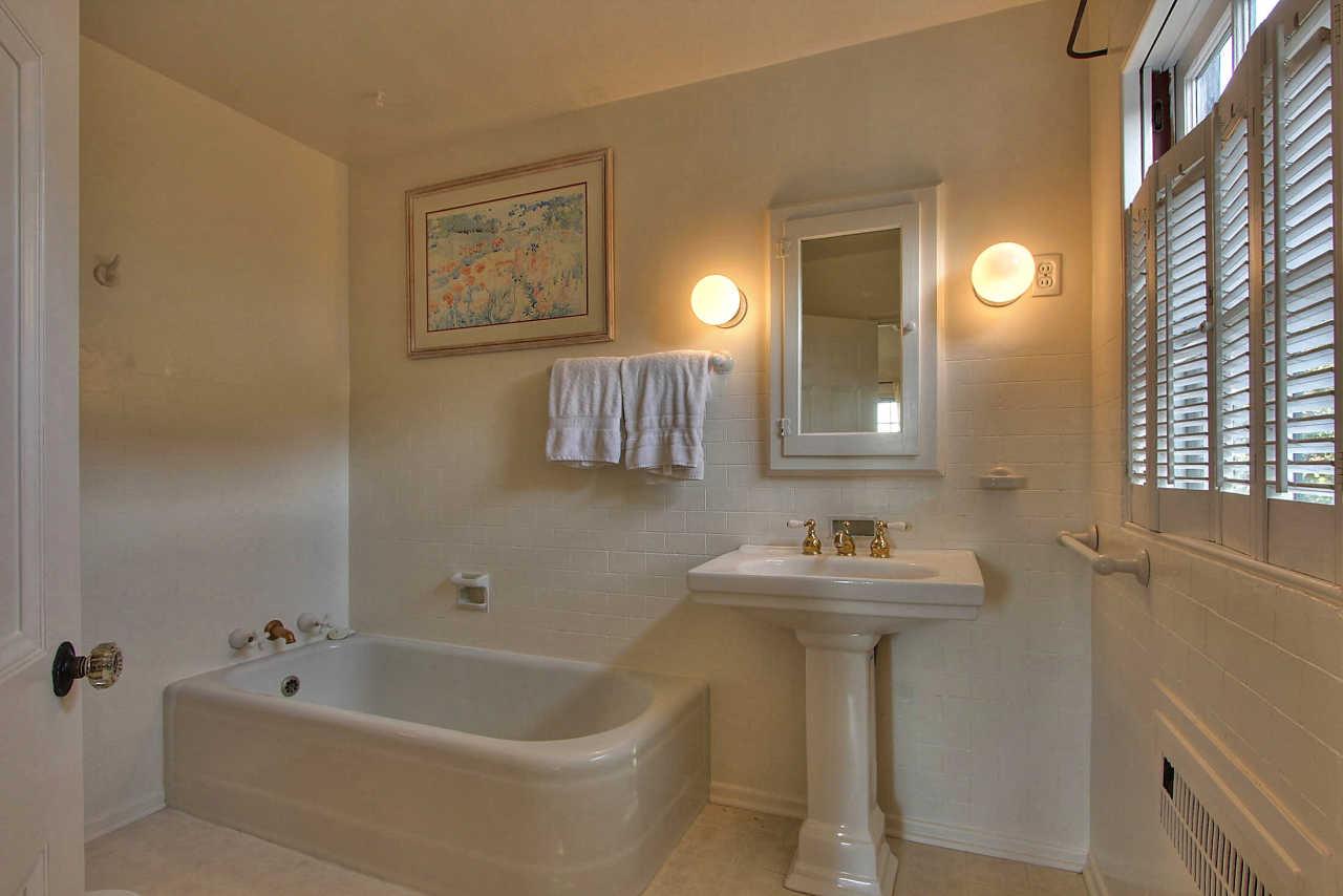 3035 Valdez Road Pebble Beach, CA 93953 - Photo 21 of 60 a bathroom with a sink and a bathtub
