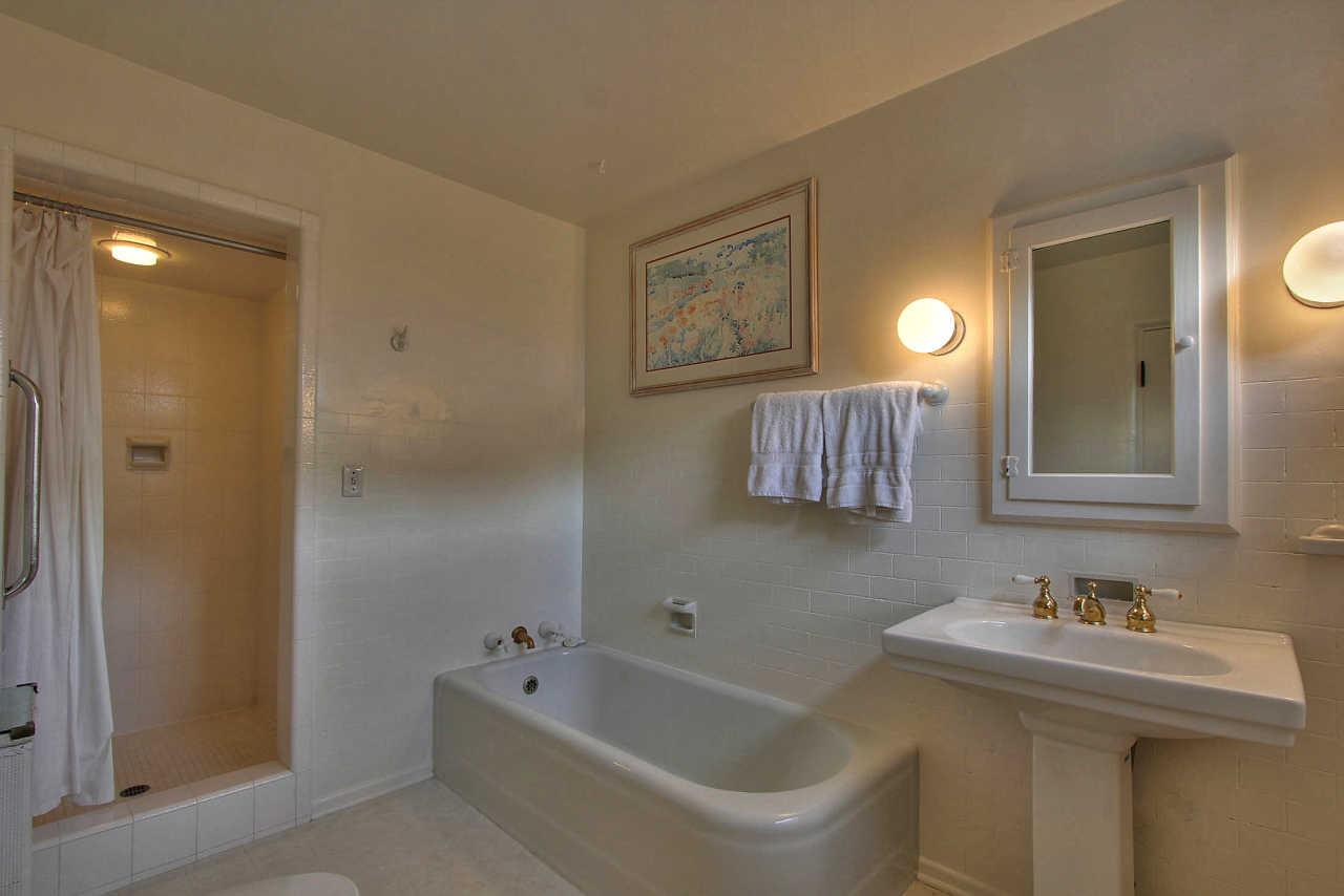 3035 Valdez Road Pebble Beach, CA 93953 - Photo 22 of 60 a bathroom with a sink and a bathtub