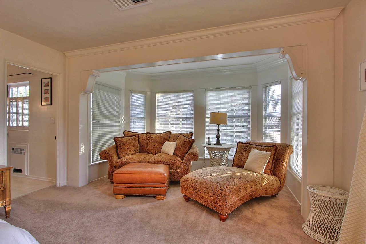 3035 Valdez Road Pebble Beach, CA 93953 - Photo 23 of 60 a living room with furniture and a mirror