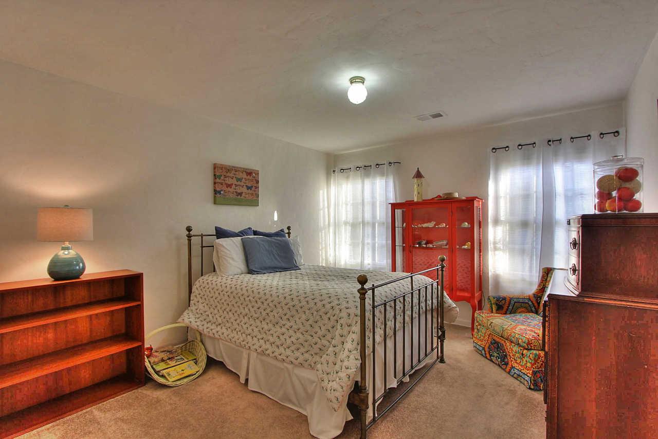 3035 Valdez Road Pebble Beach, CA 93953 - Photo 24 of 60 a bedroom with a bed and dresser