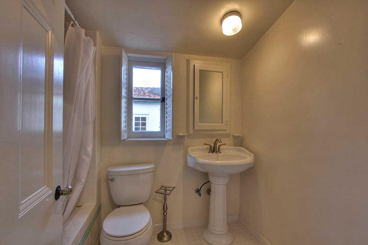 3035 Valdez Road Pebble Beach, CA 93953 - Photo 25 of 60 a bathroom with a toilet sink and mirror
