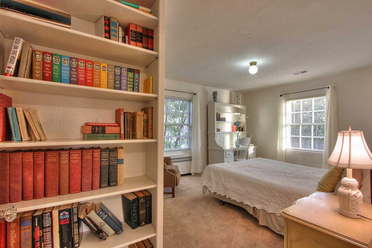 3035 Valdez Road Pebble Beach, CA 93953 - Photo 26 of 60 a bedroom with furniture book shelf and a book shelf