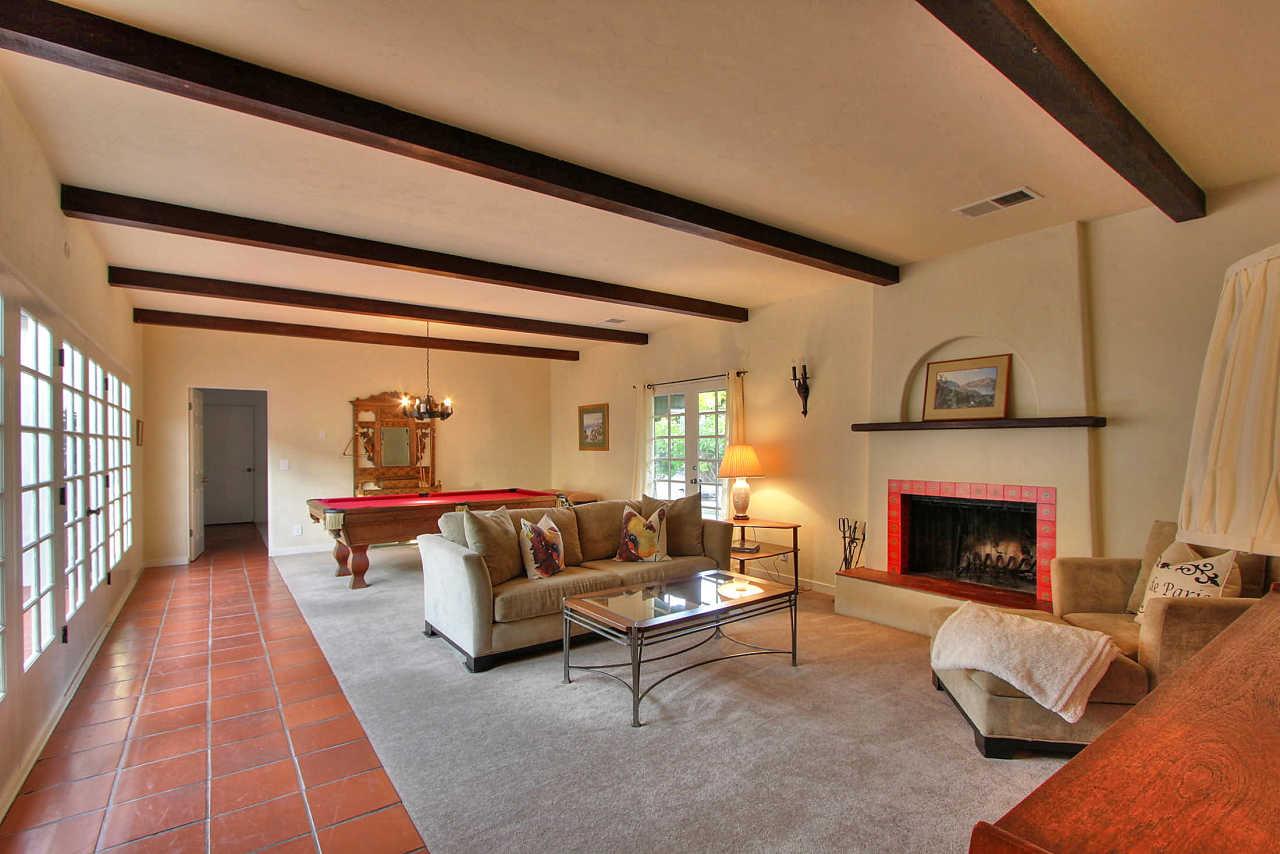 3035 Valdez Road Pebble Beach, CA 93953 - Photo 29 of 60 a living room with furniture and a fireplace