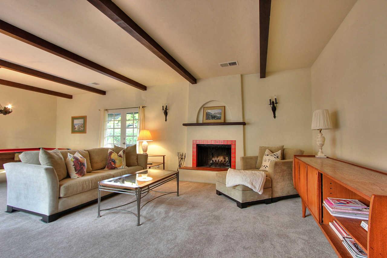 3035 Valdez Road Pebble Beach, CA 93953 - Photo 30 of 60 a living room with furniture and a fireplace
