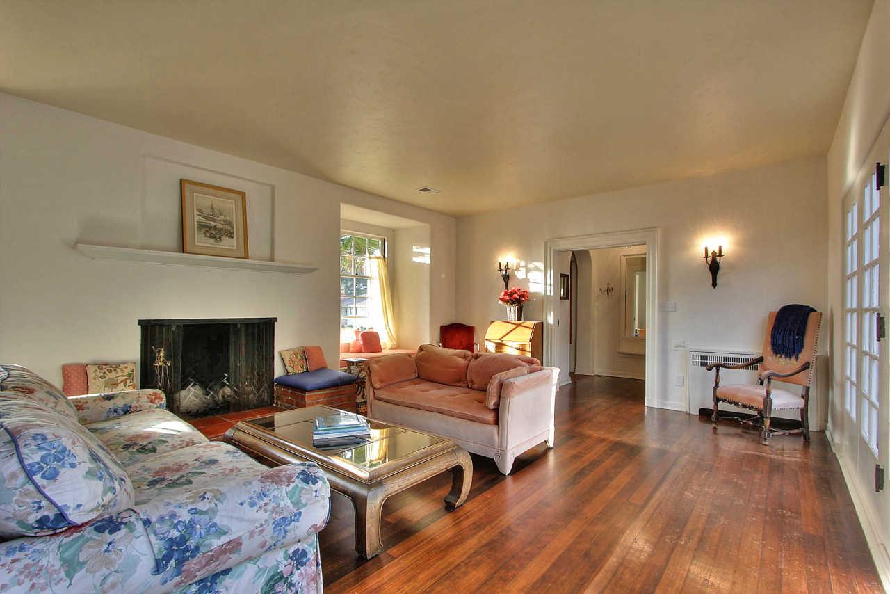 3035 Valdez Road Pebble Beach, CA 93953 - Photo 3 of 60 a living room with furniture dining table and a fireplace
