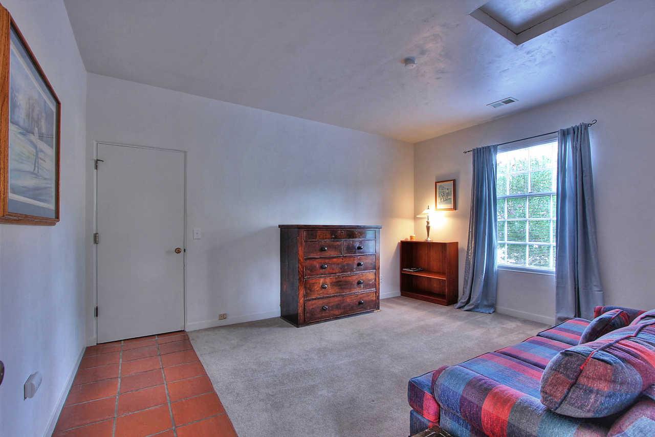 3035 Valdez Road Pebble Beach, CA 93953 - Photo 35 of 60 a bedroom with a bed and a window