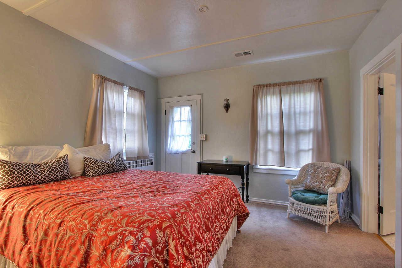 3035 Valdez Road Pebble Beach, CA 93953 - Photo 36 of 60 a bedroom with a bed and a window