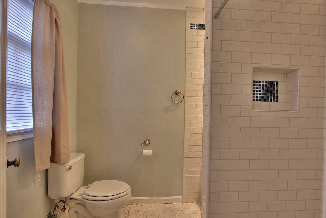 3035 Valdez Road Pebble Beach, CA 93953 - Photo 40 of 60 a bathroom with a toilet and a shower