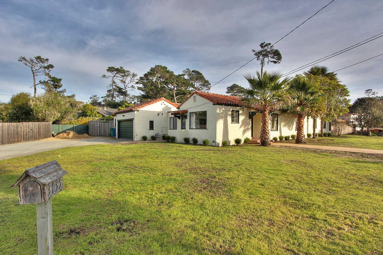 3035 Valdez Road Pebble Beach, CA 93953 - Photo 43 of 60 a front view of a house with a yard and trees