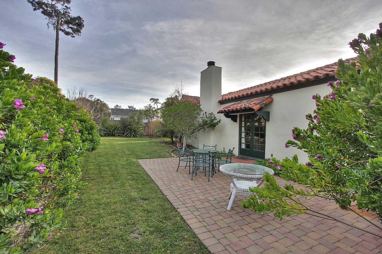 3035 Valdez Road Pebble Beach, CA 93953 - Photo 47 of 60 a view of a patio with table and chairs and potted plants