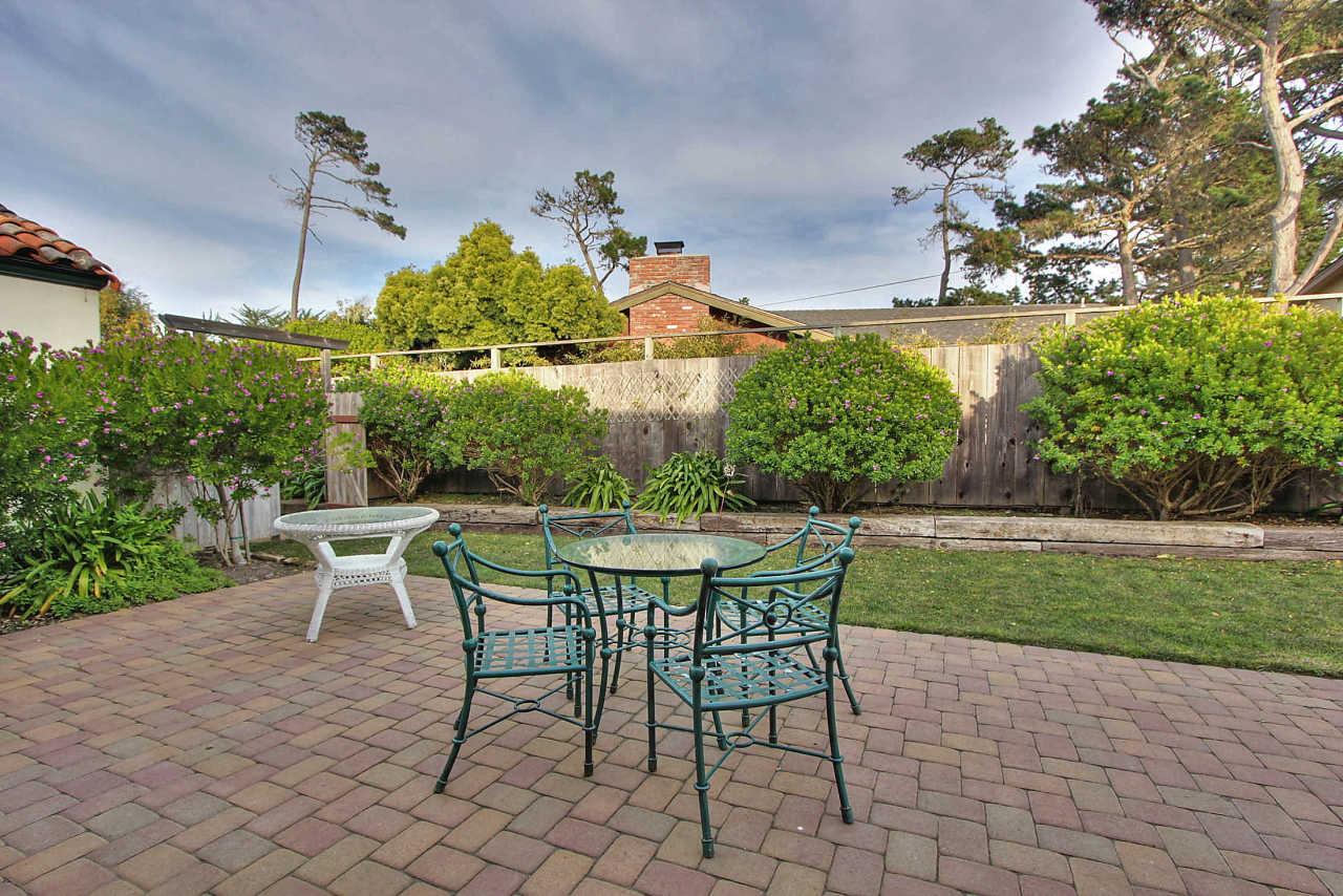 3035 Valdez Road Pebble Beach, CA 93953 - Photo 48 of 60 a view of a patio with a table and chairs