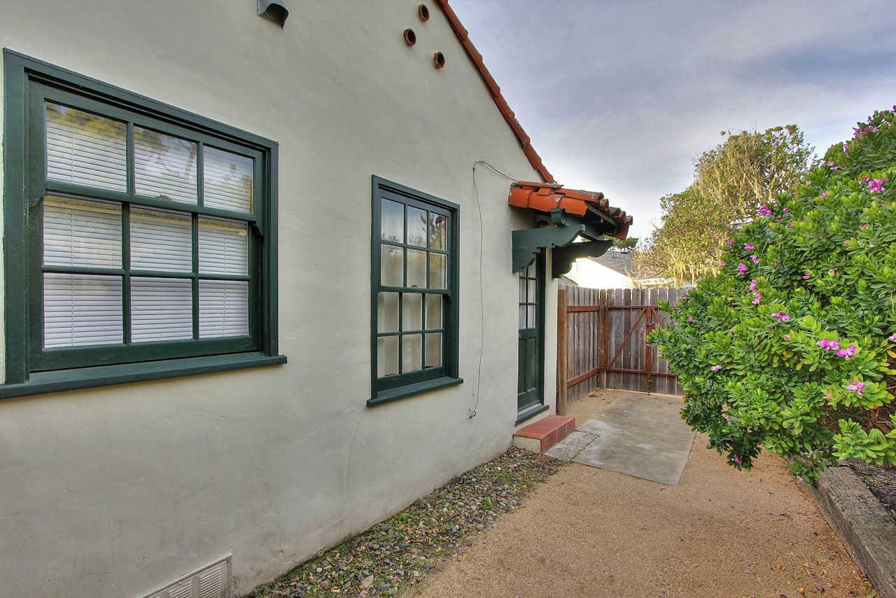 3035 Valdez Road Pebble Beach, CA 93953 - Photo 50 of 60 a view of a house with a potted plant and a window